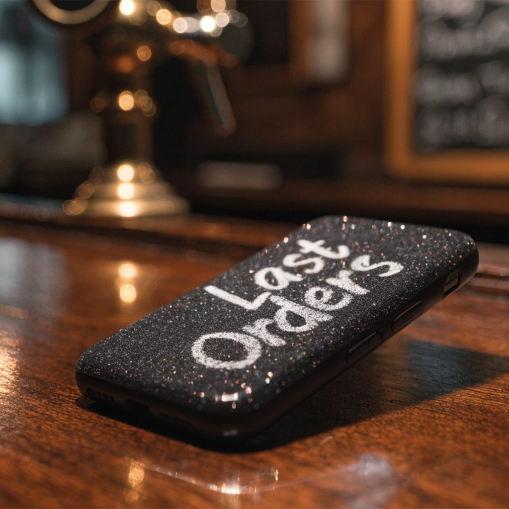 Unbranded glitter Last Orders phone case on a dark pub bar (product image, invented unbranded)