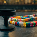Unbranded phone grip and beaded charm strap on chalkboard bar (product image, invented unbranded)