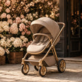 Champagne Latte City Stroller – latte/beige city stroller with gold frame outside a flower shop