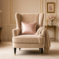 Champagne Velvet Throne Nursing Chair – champagne wingback chair with blush cushion and fringed throw