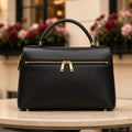 Midnight Gilded Changing Bag – black top-handle changing bag with gold zip
