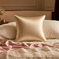 Mulberry Silk Beauty-Sleep Pillowcase – champagne satin cushion/pillowcase on bed with blush lace